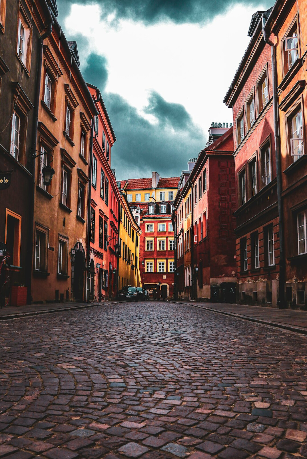 Historic old town street with colorful tenement houses in Poland