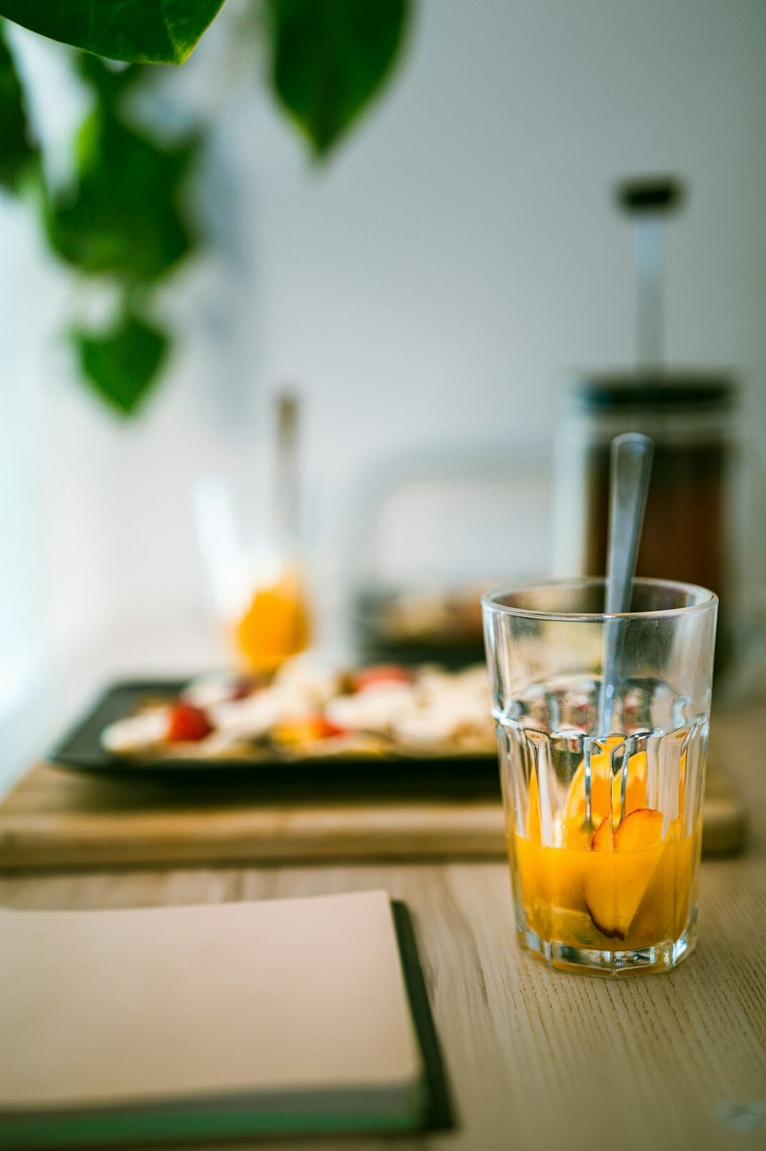 Open notebook with pen and coffee on a table